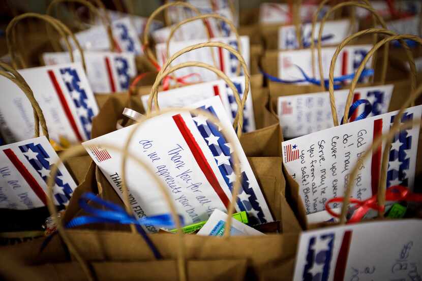 Republic Title employees pack gifts/notes of encouragement to first responders in honor of...