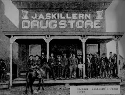 Photograph of J.A. Skillern and a crowd of men in front of the first Skillern’s Drug Store...