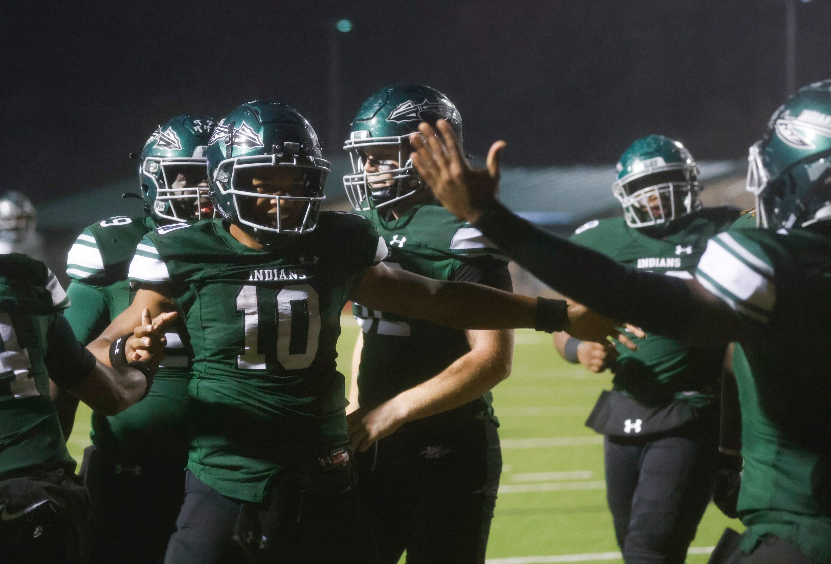 Waxahachie’s Roderick Hartsfield Jr. (10) celebrates a touchdown against Lakeridge during...