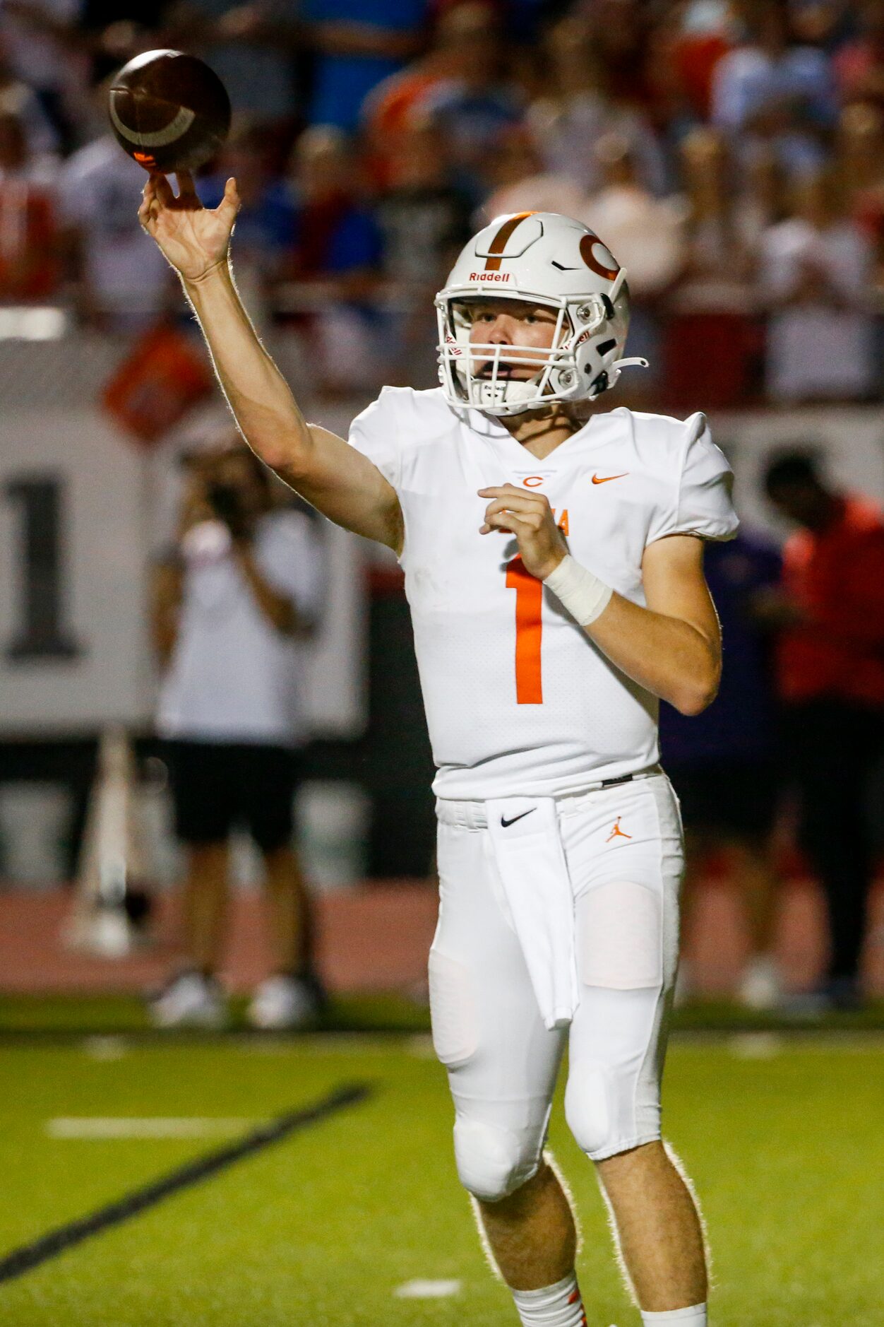 Celina quarterback Noah Bentley (1) throws a pass during the first half of a high school...