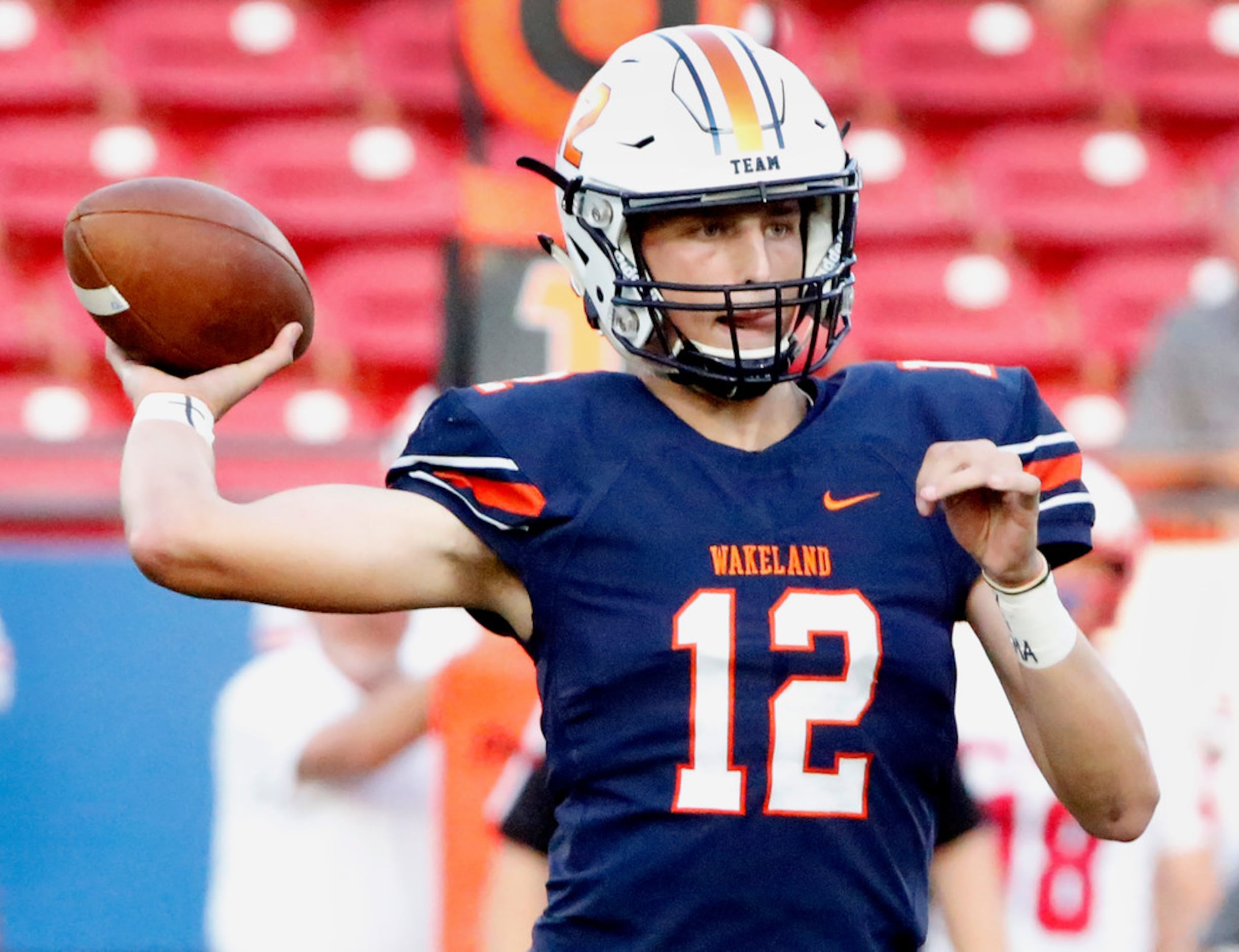 Frisco Wakeland High School quarterback Dylan Laible (12) throws a pass during the first...