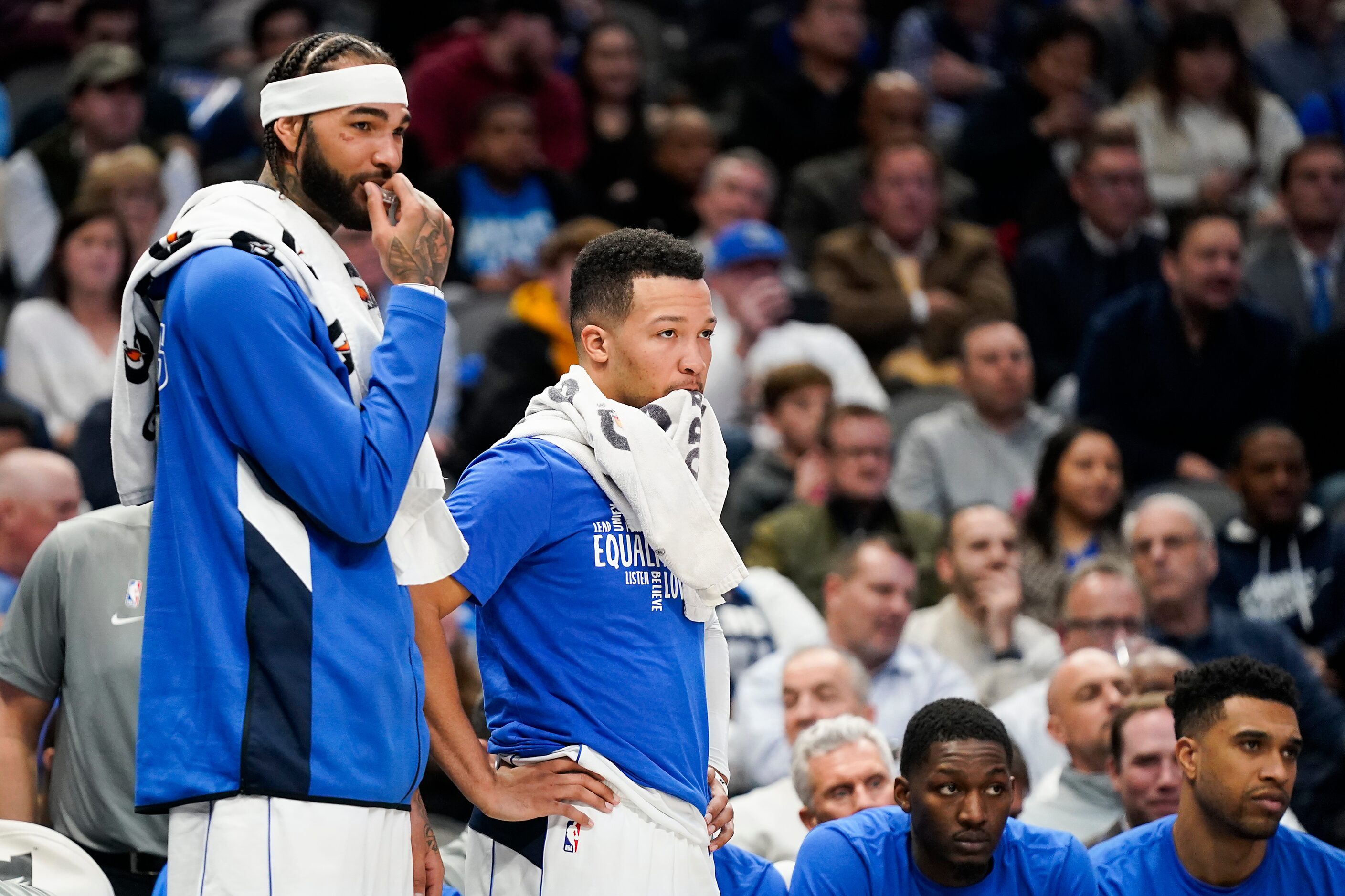 Dallas Mavericks center Willie Cauley-Stein (left) and guard Jalen Brunson watch from the...