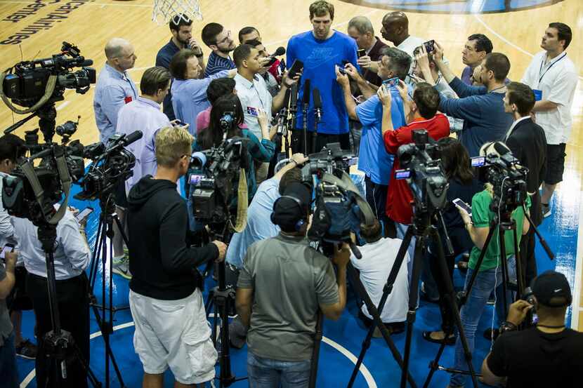 Dallas Mavericks forward Dirk Nowitzki addresses the media as the team conducts exit...