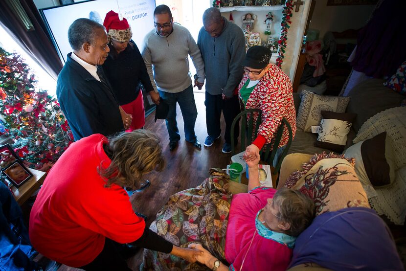 Williams Chicken CEO and founder Hiawatha Williams (top left in blue coat) and his wife,...