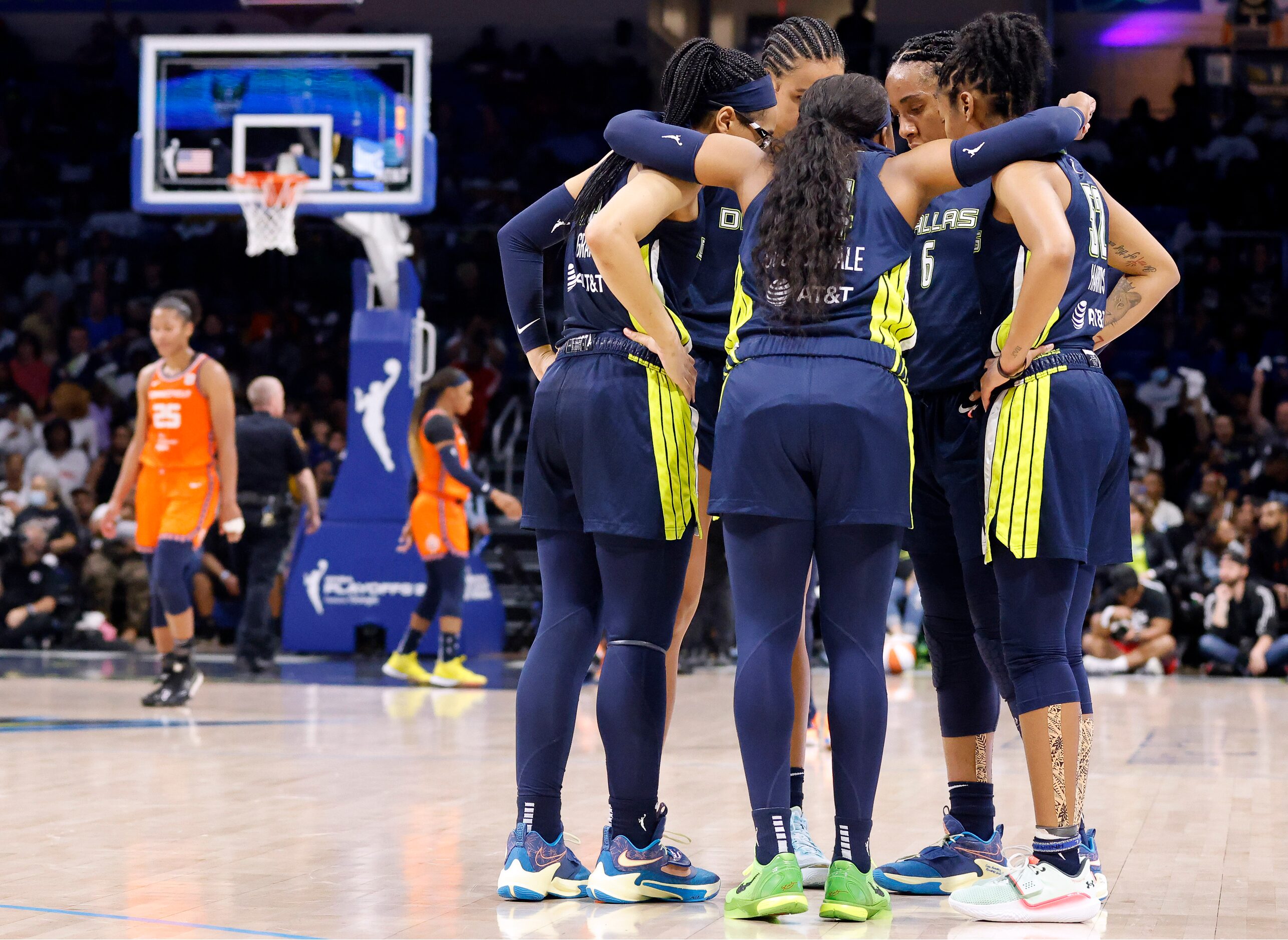 Dallas Wings guard Arike Ogunbowale (24) gathers her teammates during a fourth quarter...