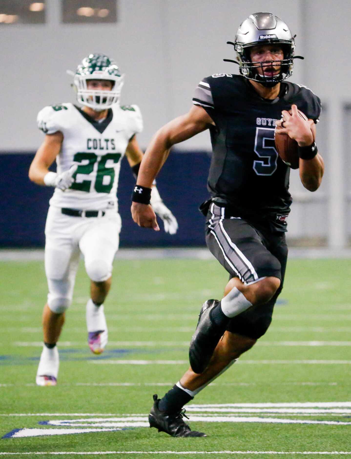 Denton Guyer's quarterback Eli Stowers (5) runs 37 yards for the first touchdown in the...
