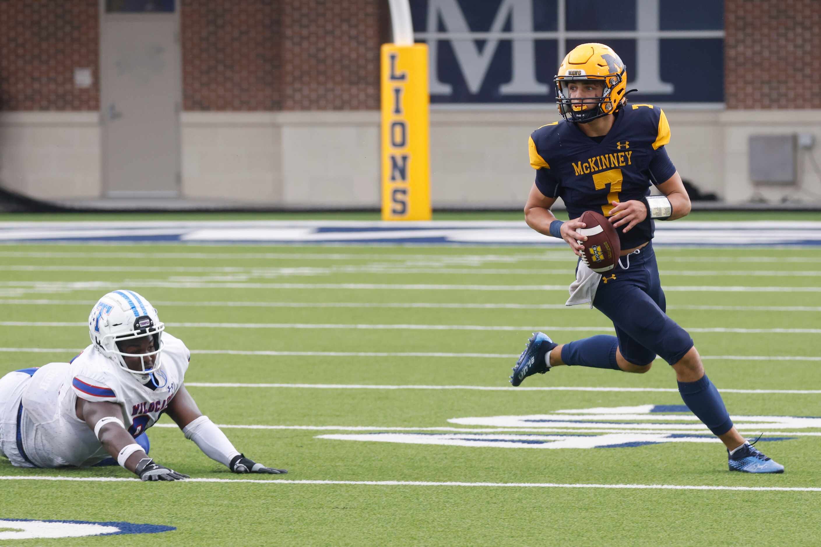 McKinney High’s QB Owen Fann (7) looks to throw the ball against Temple High during a...