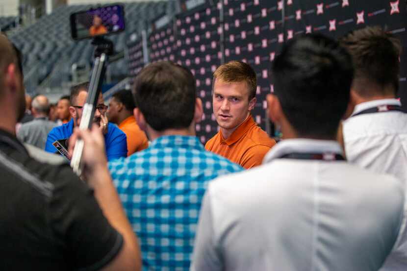 University of Texas football quarterback Sam Ehlinger speaks with reporters during the...