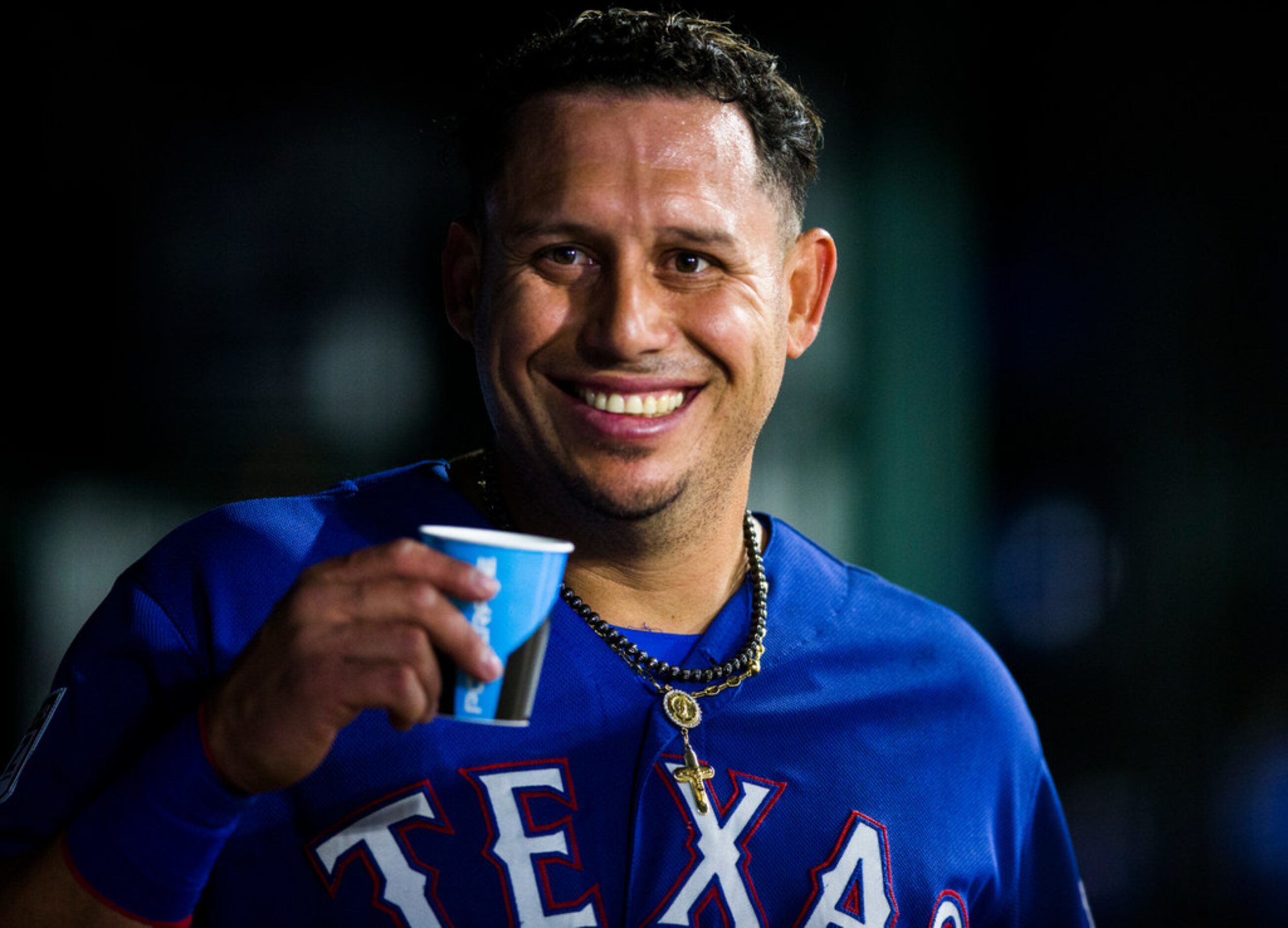 Texas Rangers third baseman Asdrubal Cabrera (14) smiles in the dugout during the fifth...