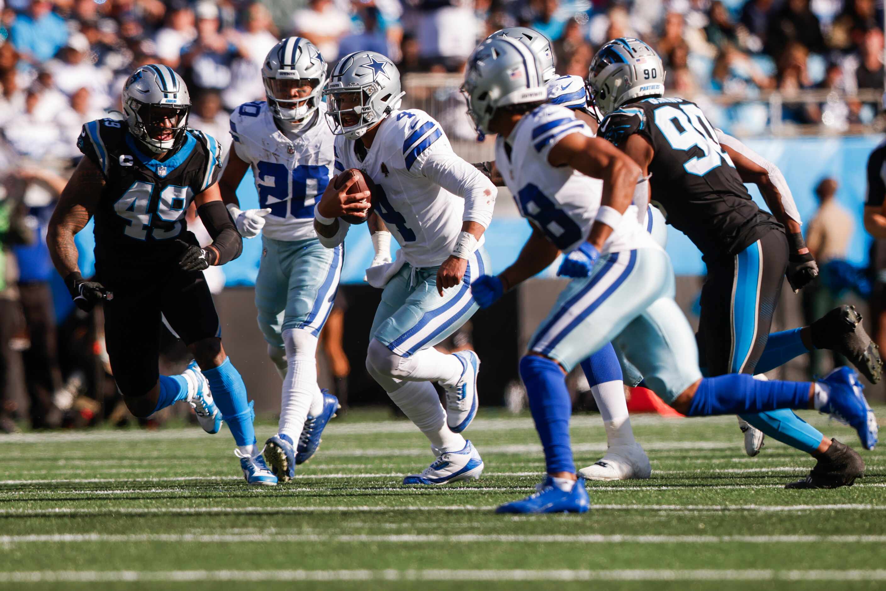 Dallas Cowboys quarterback Dak Prescott (4) runs the ball during the second quarter of a NFL...