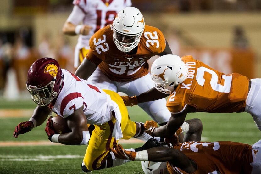 USC Trojans running back Stephen Carr (7) is tackled by Texas Longhorns defensive lineman...