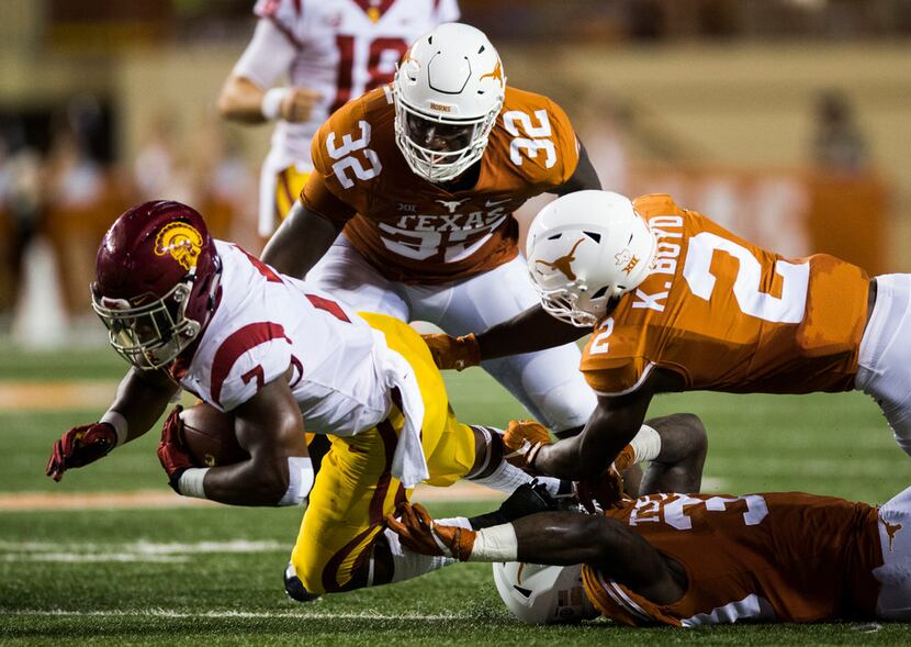 USC Trojans running back Stephen Carr (7) is tackled by Texas Longhorns defensive lineman...
