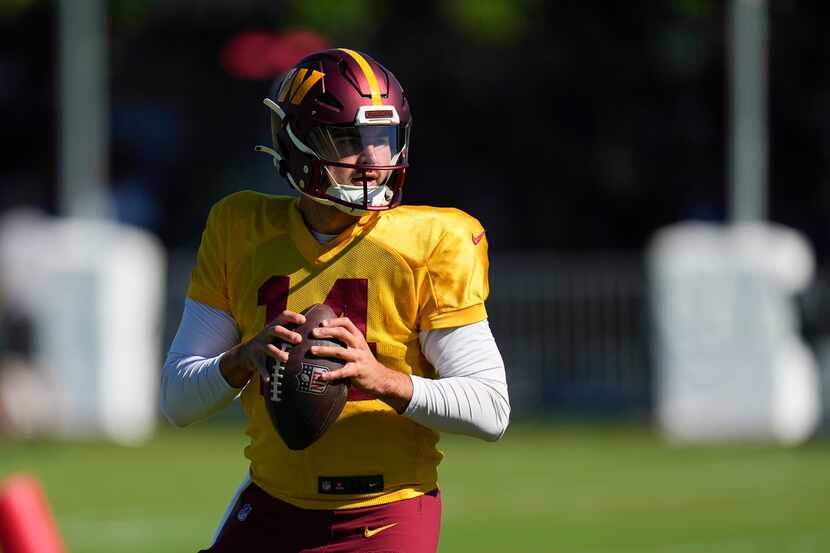 Washington Commanders quarterback Sam Howell works out during a joint NFL football practice...