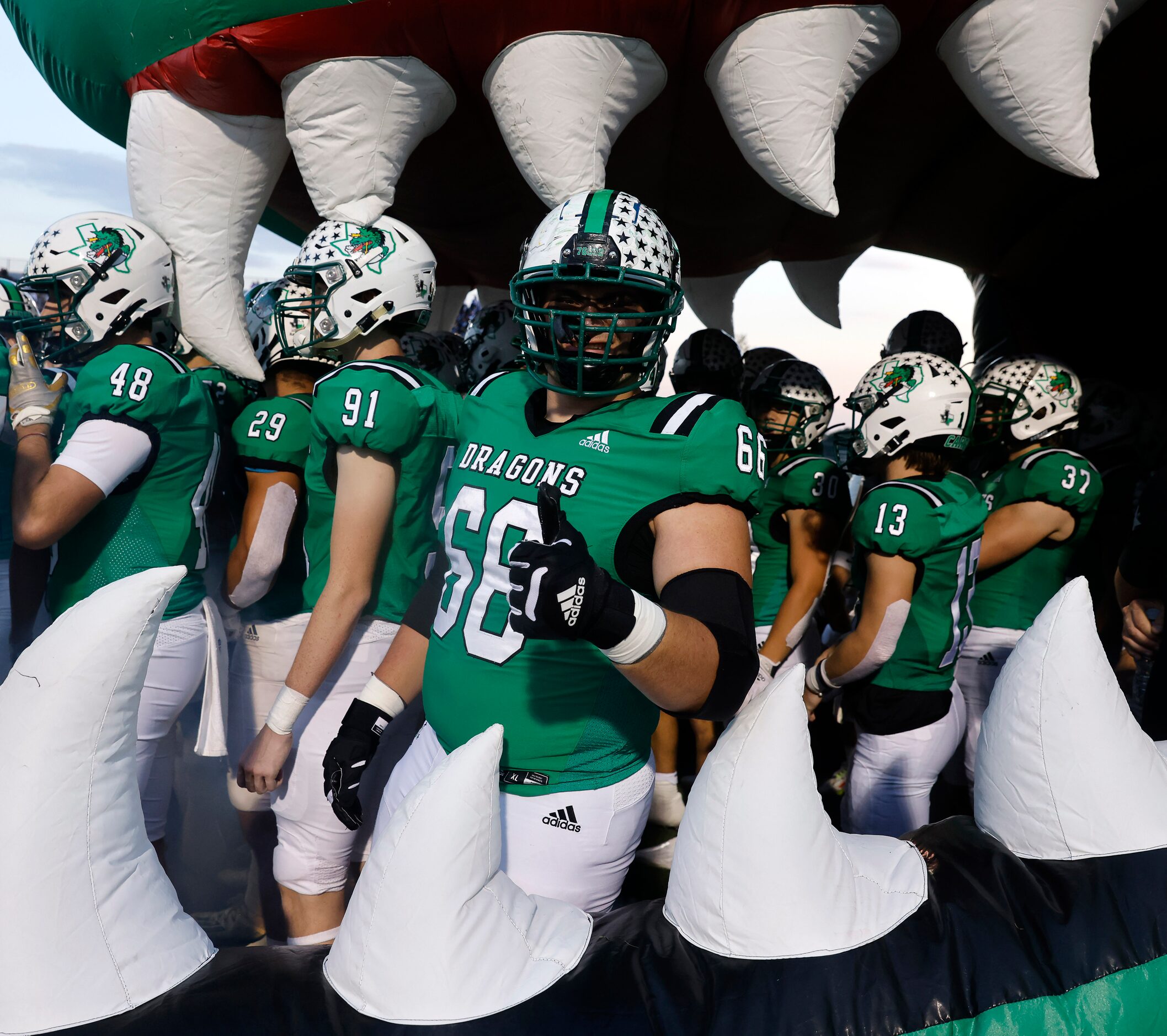 Southlake Carroll offensive lineman Arthur Clayton (66) gives a thumbs up before being...