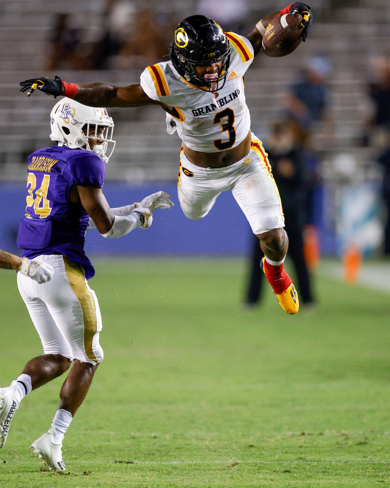 Grambling State running back Floyd Chalk IV (3) tries to hurdle Prairie View A&M cornerback...