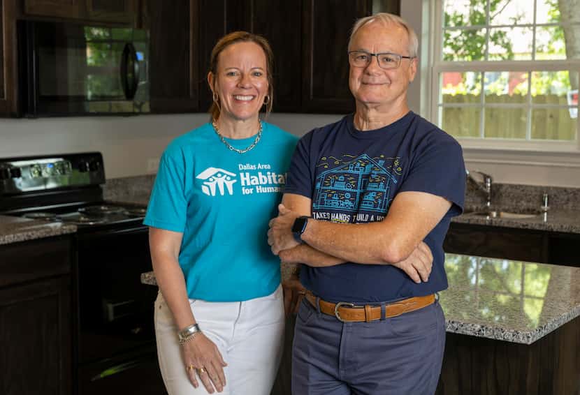 Dallas Area Habitat for Humanity CEO Ashley Brundage (left) stands with Habitat board member...