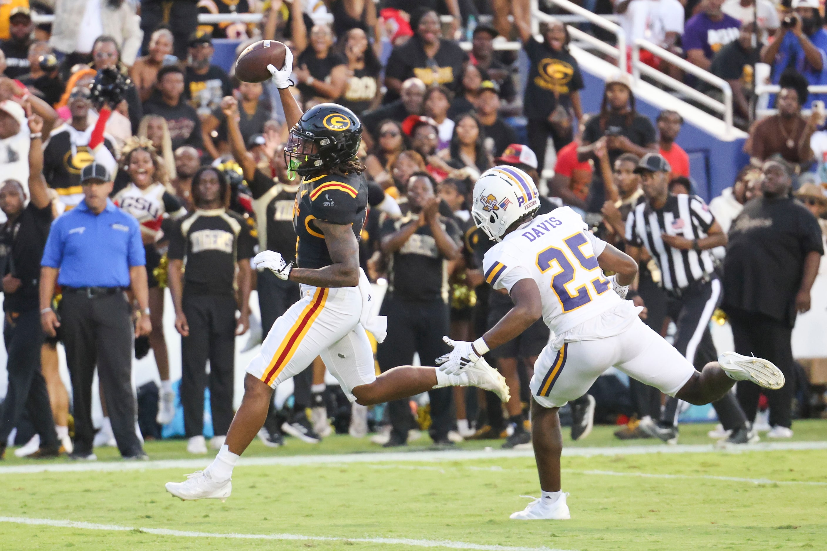 Grambling State running back Tre Bradford (left) celebrates a touchdown past Prairie View...