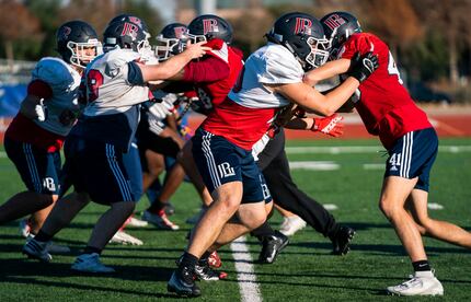 The John Paul II High School football team practices on Tuesday, December 3, 2019 in Plano....
