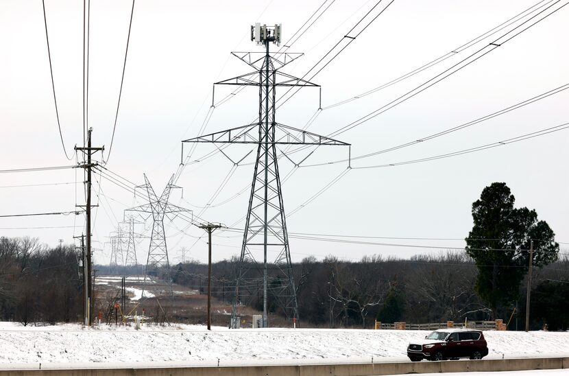 Large electrical transmission lines cross over SH 287 in South Arlington, Wednesday,...