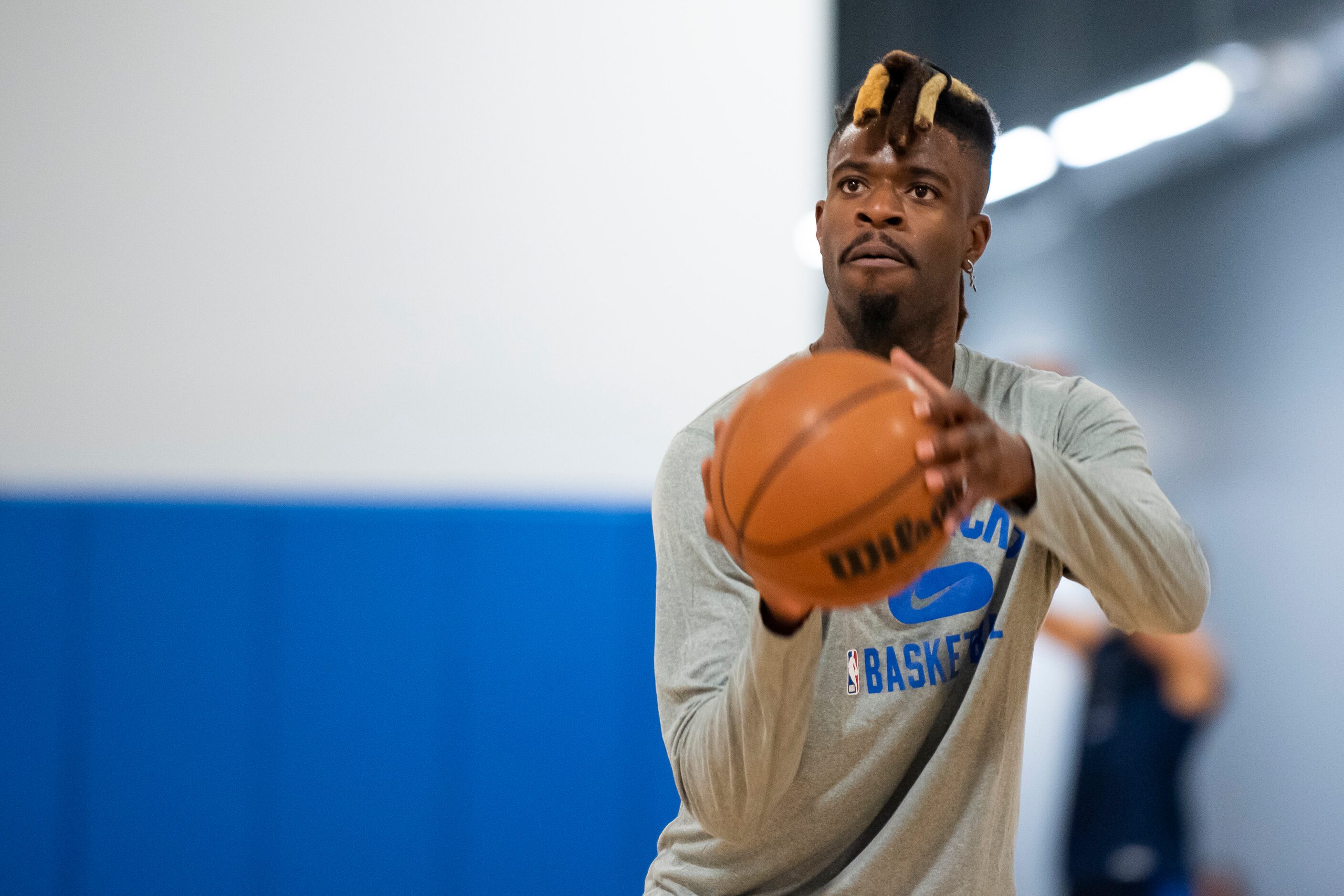 Dallas Mavericks shooting forward Reggie Bullock (25) shoots a three-pointer while...