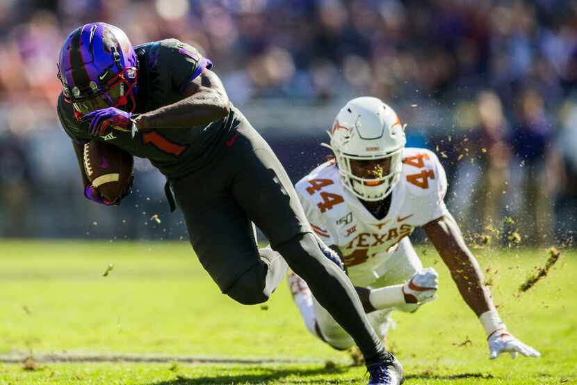 TCU Horned Frogs wide receiver Jalen Reagor (1) escapes a tackle by Texas Longhorns...