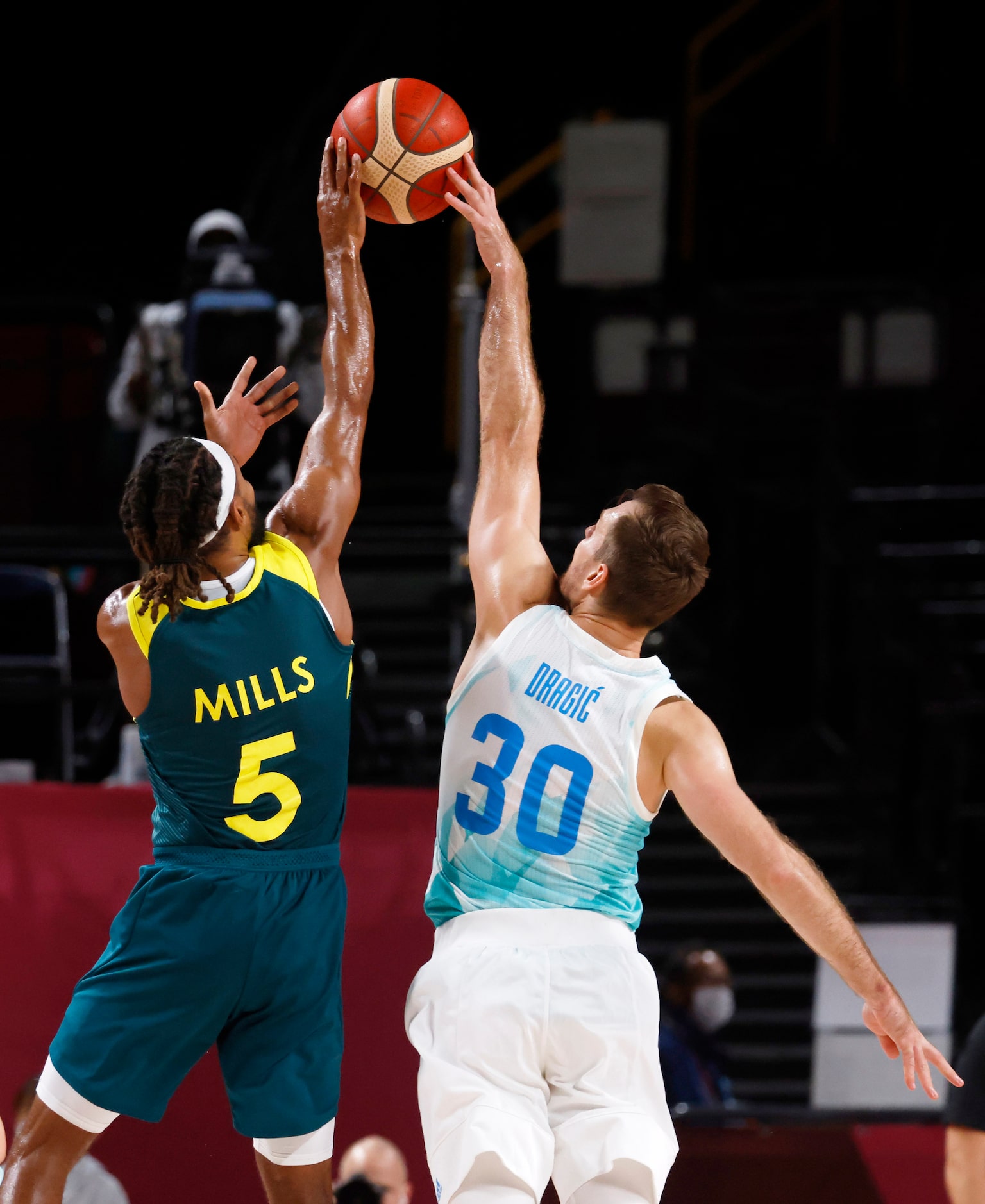 Slovenia’s Zoran Dragic (30) blocks a shot attempt from Australia’s Patty Mills (5) during...