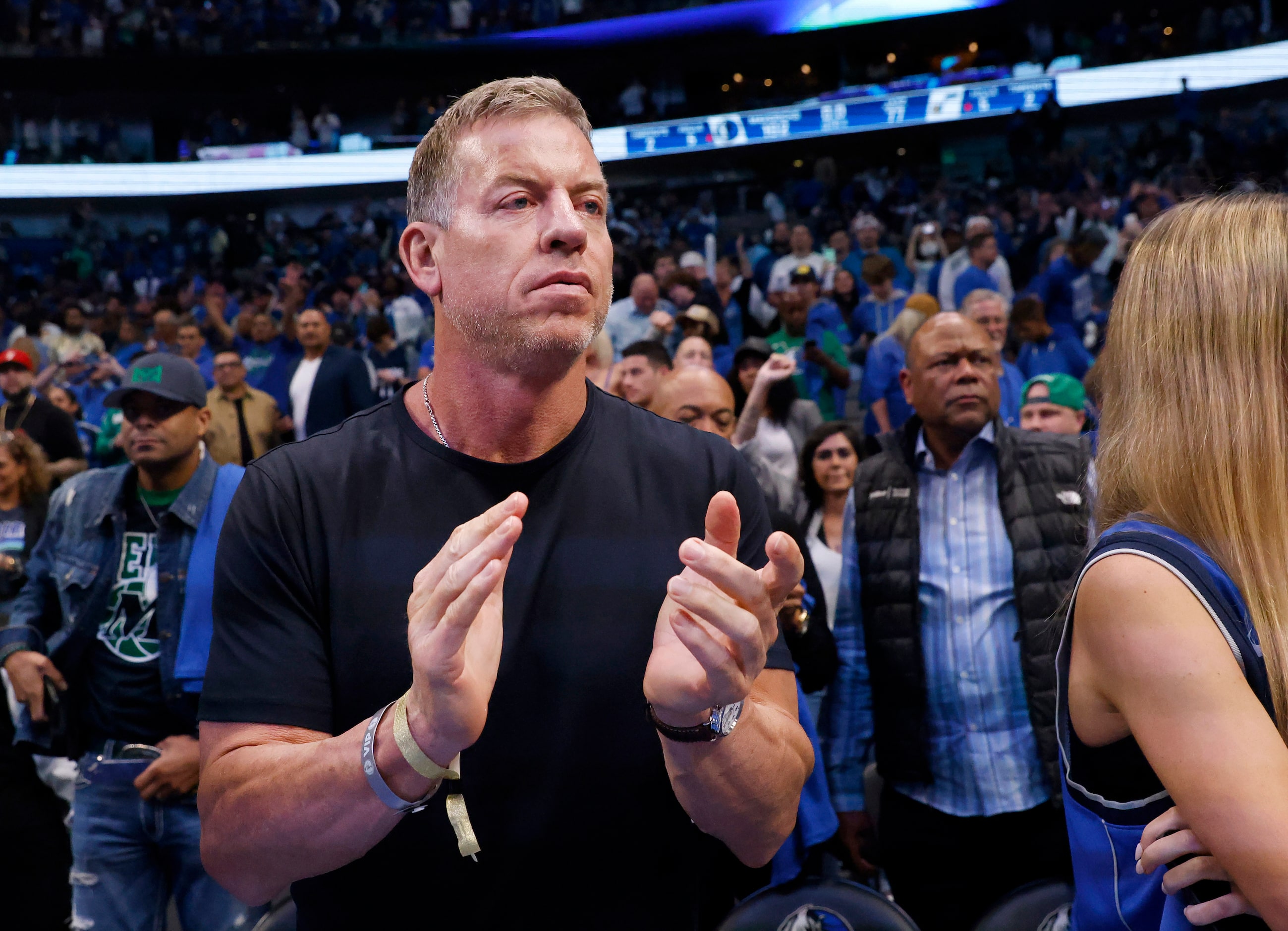 Former Dallas Cowboys Hall of Fame quarterback Troy Aikman applauds the Dallas Mavericks who...