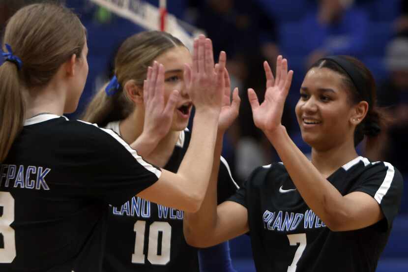 Plano West players, from left, Reese Poerner (8), Kate Mansfield (10) and Jaida Gray (7)...