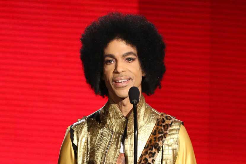 In this Nov. 22, 2015 file photo, Prince presents the award for favorite album - soul/R&B at...
