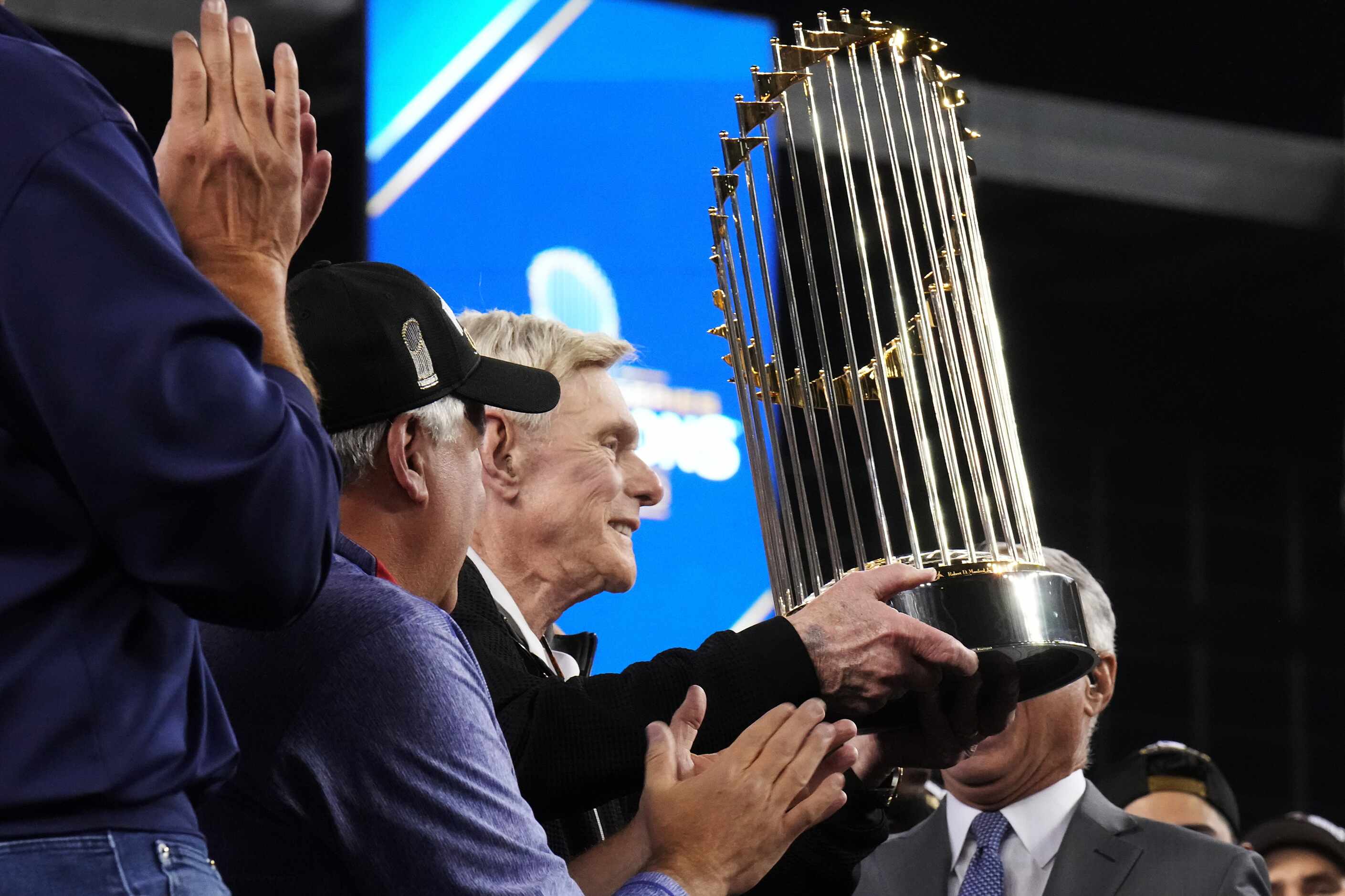 Texas Rangers owner Ray Davis is presented with the Commissioner’s Trophy after winning the...
