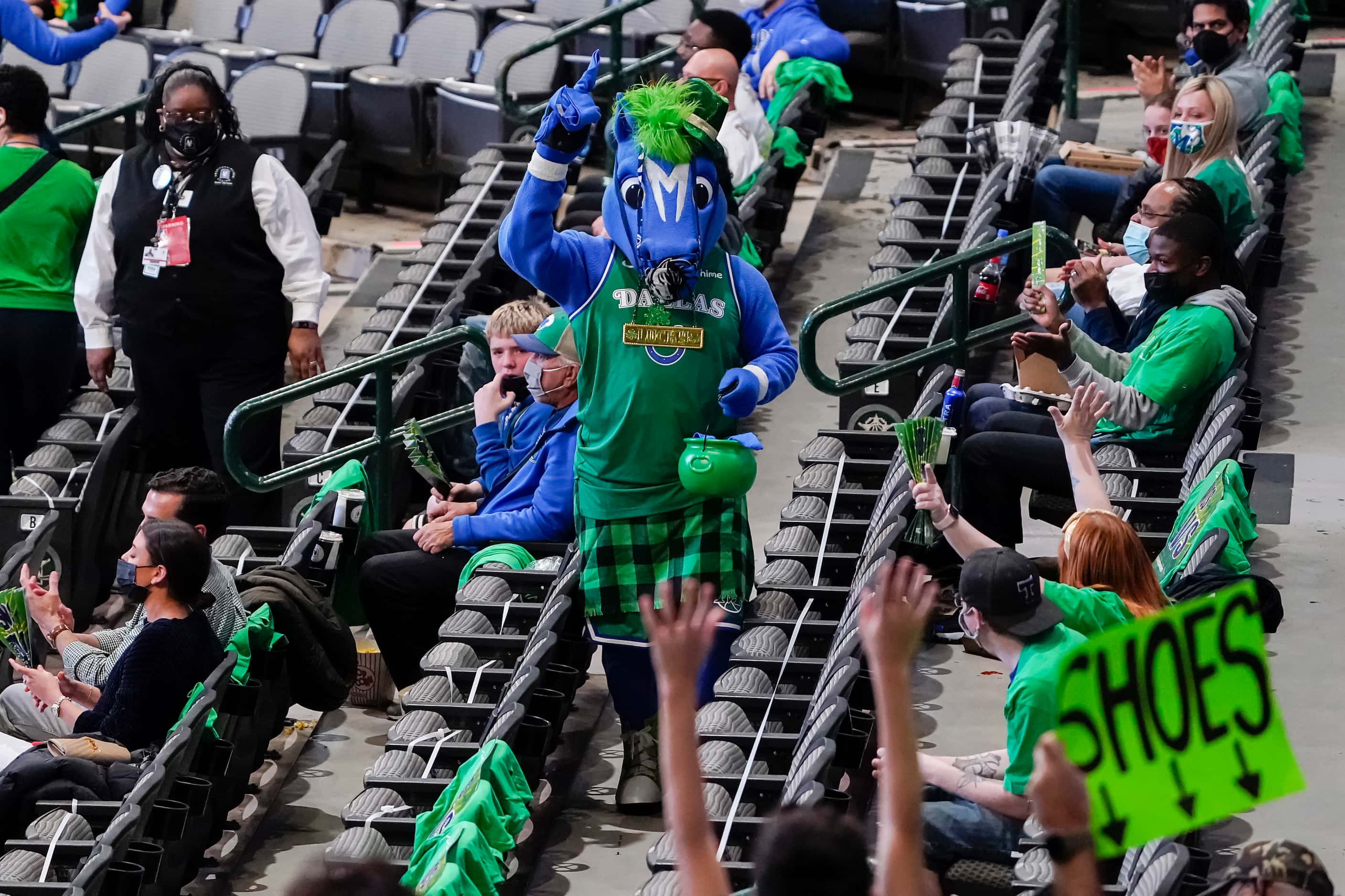 Dallas Mavericks mascot Champ prepares to toss t-shirts to fans during the first quarter of...