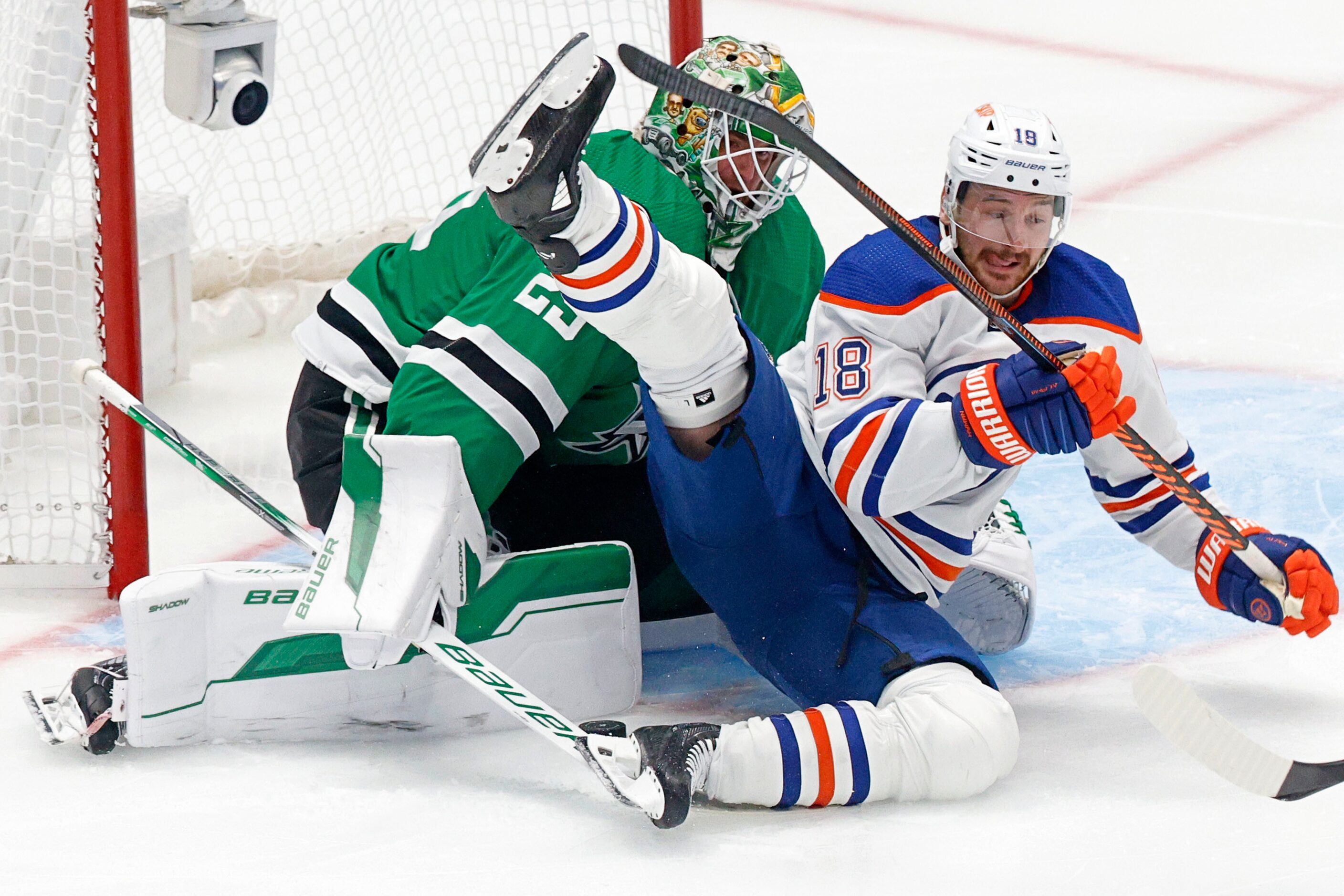 Edmonton Oilers left wing Zach Hyman (18) collides into Dallas Stars goaltender Jake...