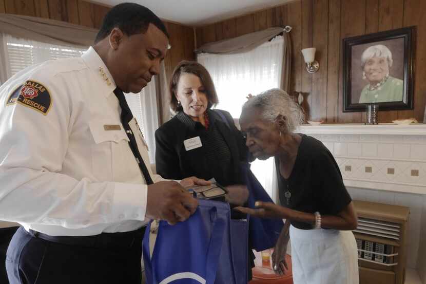  Fire Chief Louie Bright III and VNA President Katherine Krause delivered a meal to Frances...