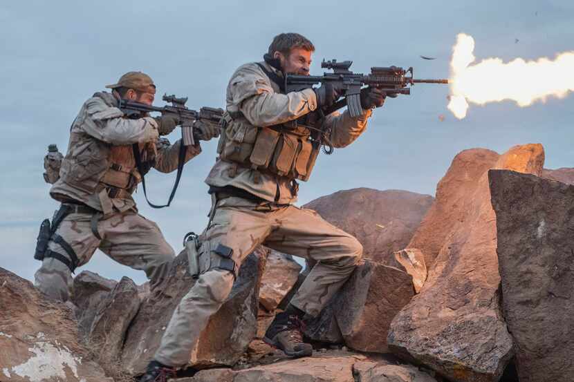 Geoff Stults, left, and Chris Hemsworth in a scene from 12 Strong. 
