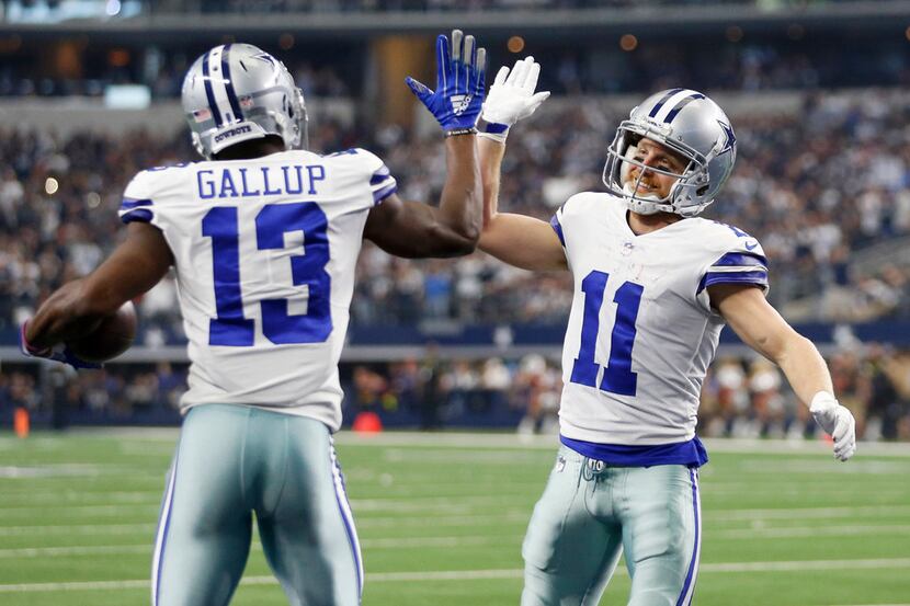 Dallas Cowboys wide receiver Michael Gallup (13) is congratulated by Dallas Cowboys wide...