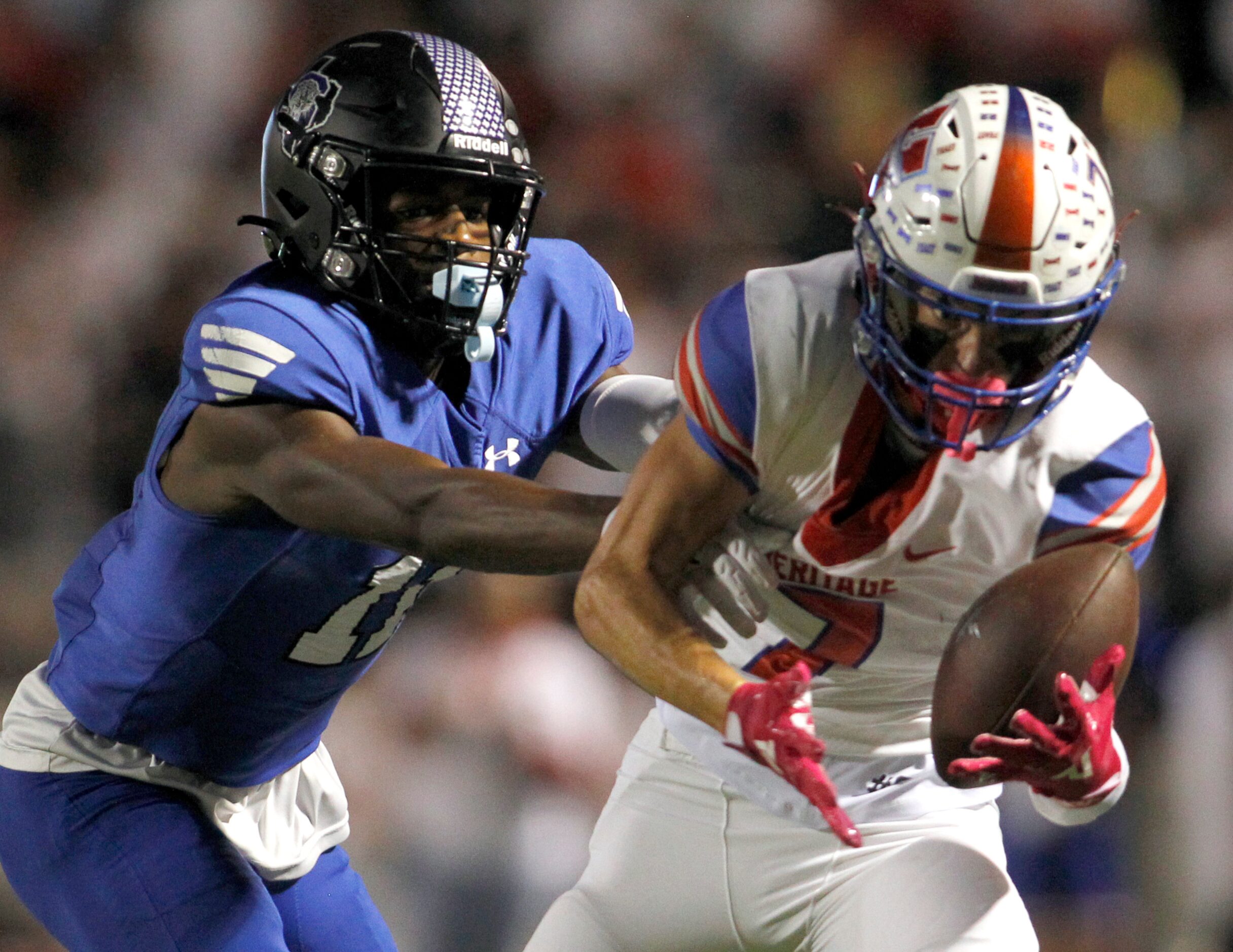 Midlothian Heritage defensive back Stetson Sarratt (7), right, steps in front of Mansfield...