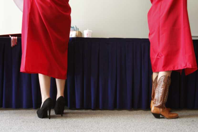 Strikingly different footwear broke the monotony of red caps and gowns for female graduates...