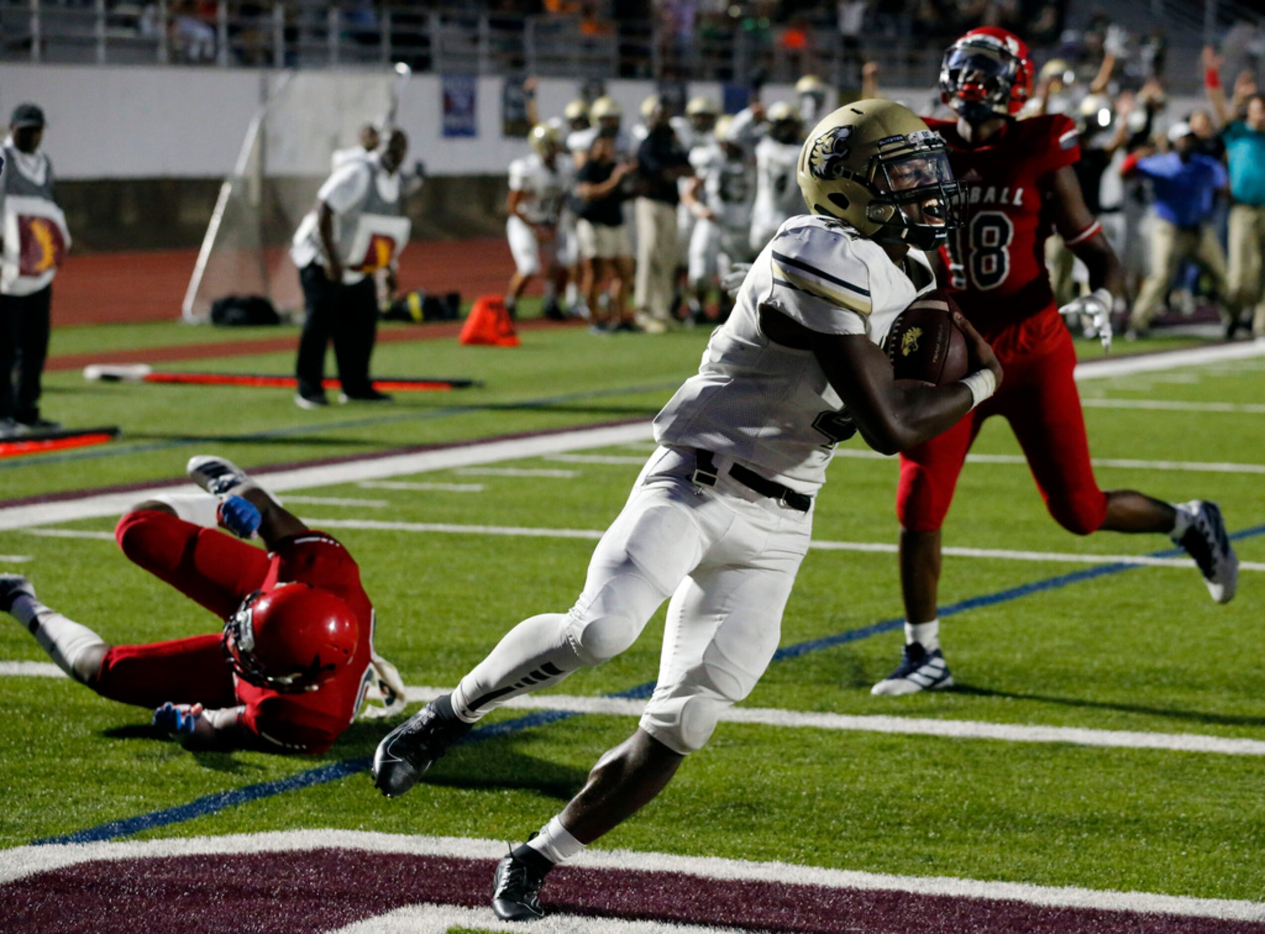 Irving High RB Chason Banks (41) is all smiles, as he takes his catch in for a touchdown...