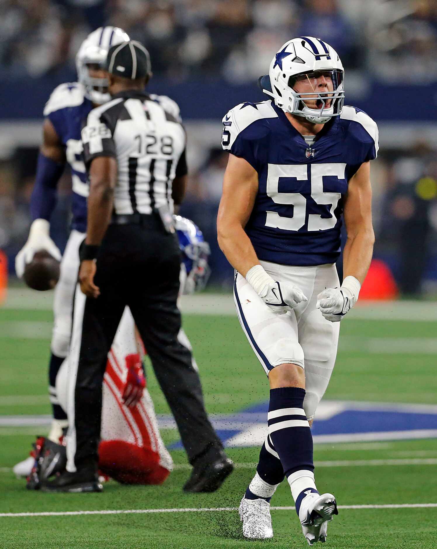 Dallas Cowboys linebacker Leighton Vander Esch (55) yells after making a stop during the...