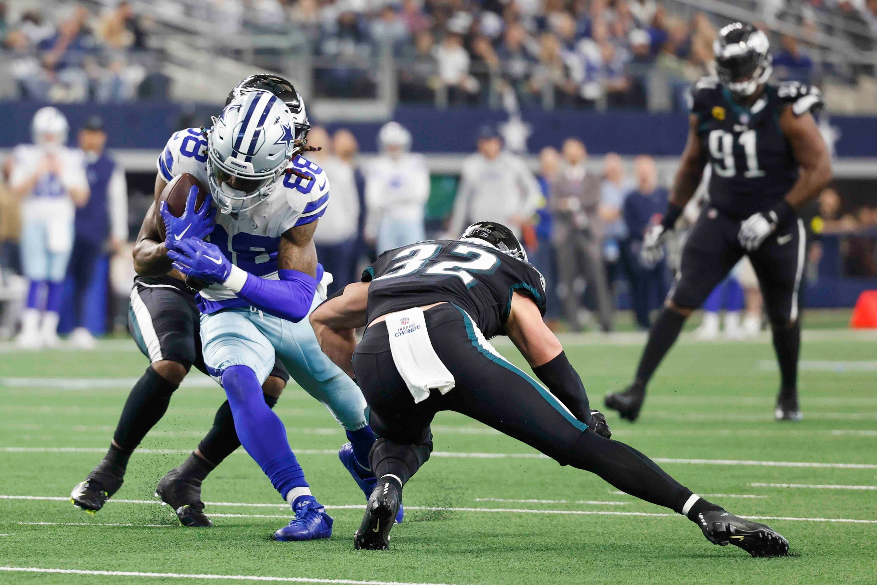 Dallas Cowboys wide receiver CeeDee Lamb (88) gets tackled by Philadelphia Eagles cornerback...