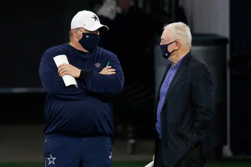 Dallas Cowboys head coach Mike McCarthy talks to Dallas Cowboys owner and general manager...