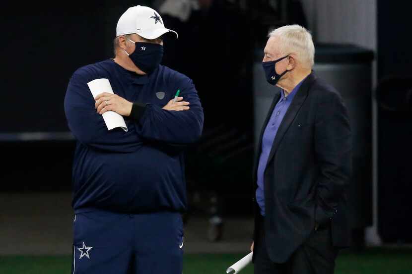 Dallas Cowboys head coach Mike McCarthy talks to Dallas Cowboys owner and general manager...