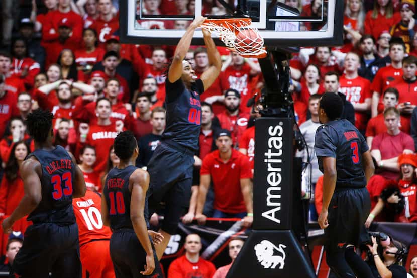 SMU's Ben Moore (00) dunks during the second half of an NCAA college basketball game against...