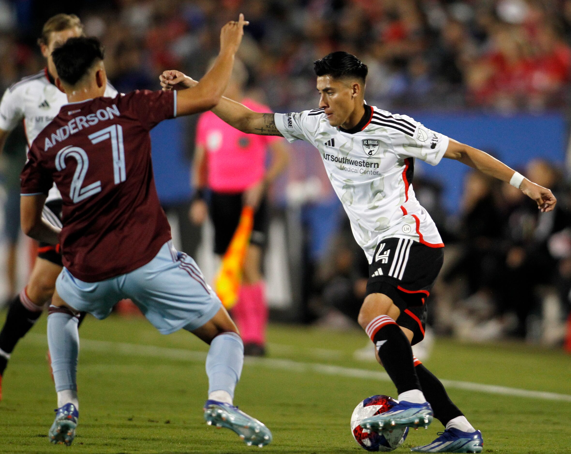 FC Dallas defender Marco farina (4), right, maneuvers the ball against the defense of...