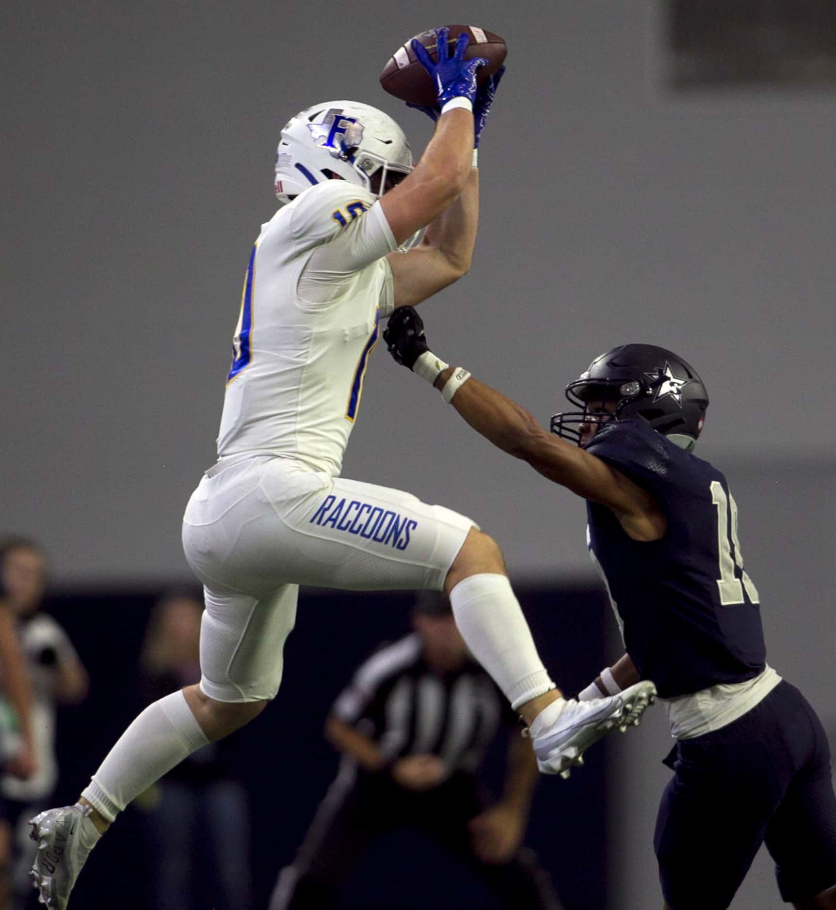 Frisco receiver Reed Engleman (10) skies to pull in a pass as he is defended by Frisco Lone...