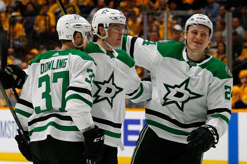 NASHVILLE, TENNESSEE - APRIL 10: Roope Hintz #24 and Justin Dowling #37 of the Dallas Stars...