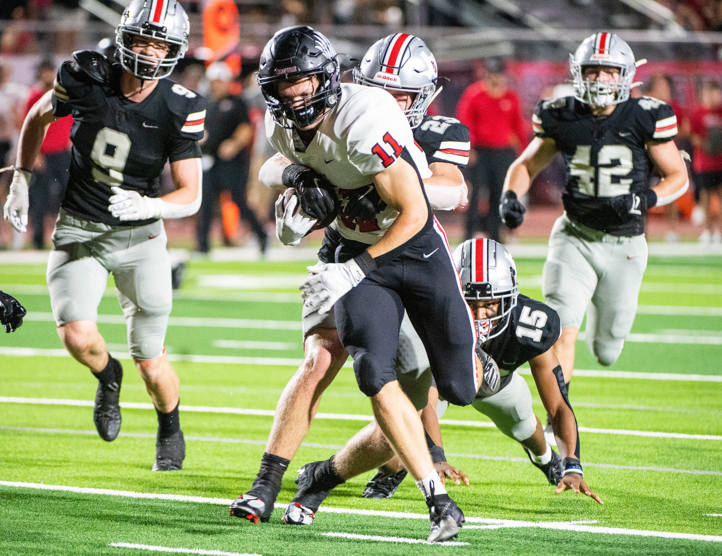 Argyle's RJ Bunnell (11) runs through a group of Lovejoy defenders including Aarren Marshall...