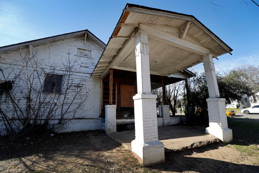 A boarded-up home at 1212 9th St. in the Tenth Street Historic District