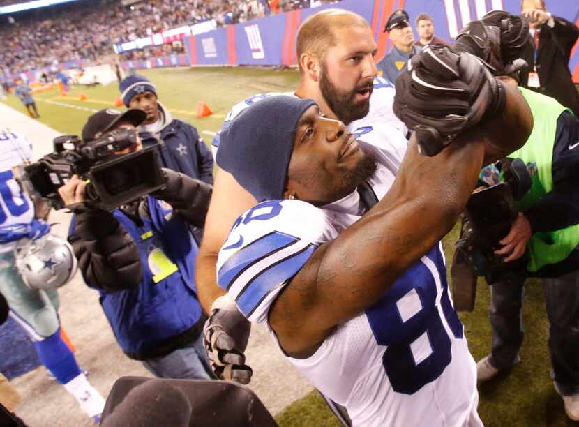Dallas Cowboys wide receiver Dez Bryant (88) gives the X to fans as he leaves the field...