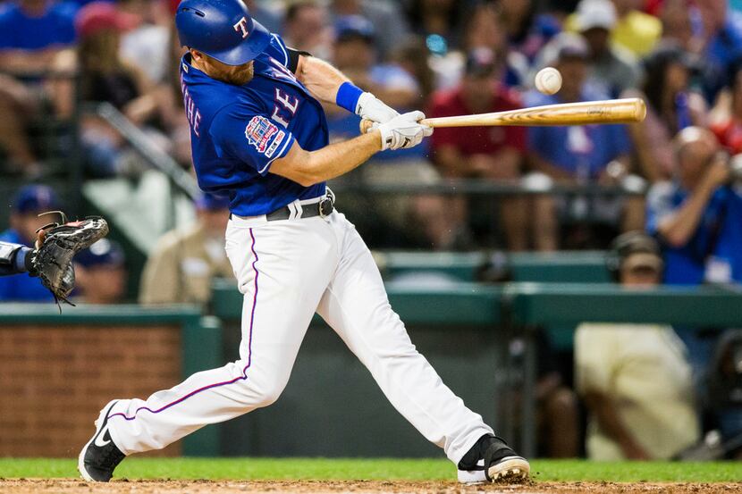 Texas Rangers short stop Logan Forsythe (41) bats during the fifth inning of an MLB game...